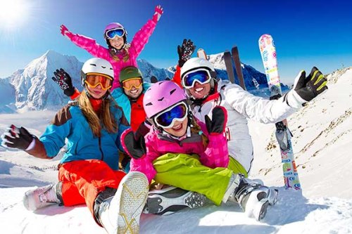 Ski, snow, sun and winter fun - happy family ski team